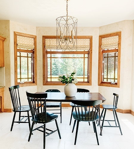 Before image of breakfast nook with wood stained windows