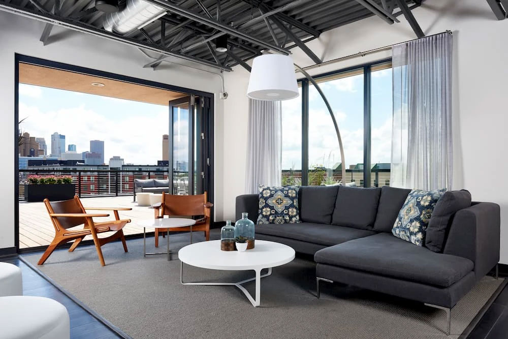 The interior of a Minneapolis apartment with new bifold patio doors and custom windows.