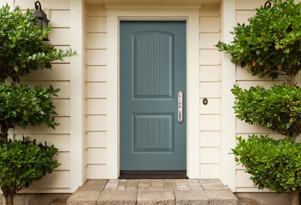 exterior view of a home with blue ash cheyenne solid fiberglass entry door