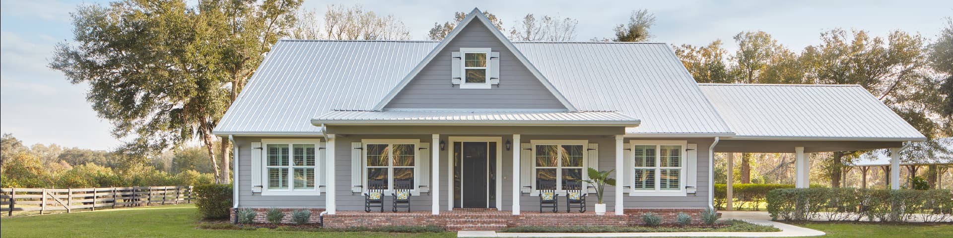 exterior of a gray home with defender series windows