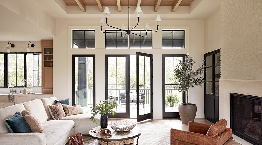 two orange contemporary chairs in front of a lifestyle four-panel sliding patio door