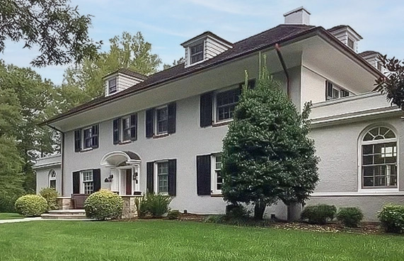 Curbside view of Wilmington colonial home with newly installed windows and doors.