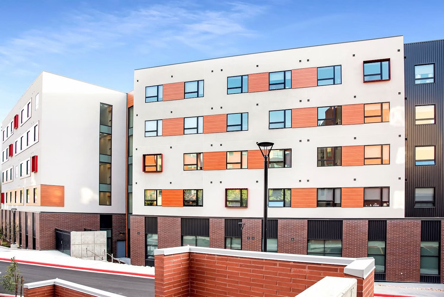 Student housing with a contemporary style and black Pella Impervia fiberglass windows