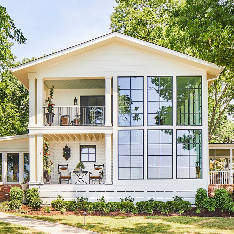 After image of remodeled lakehouse with new black windows