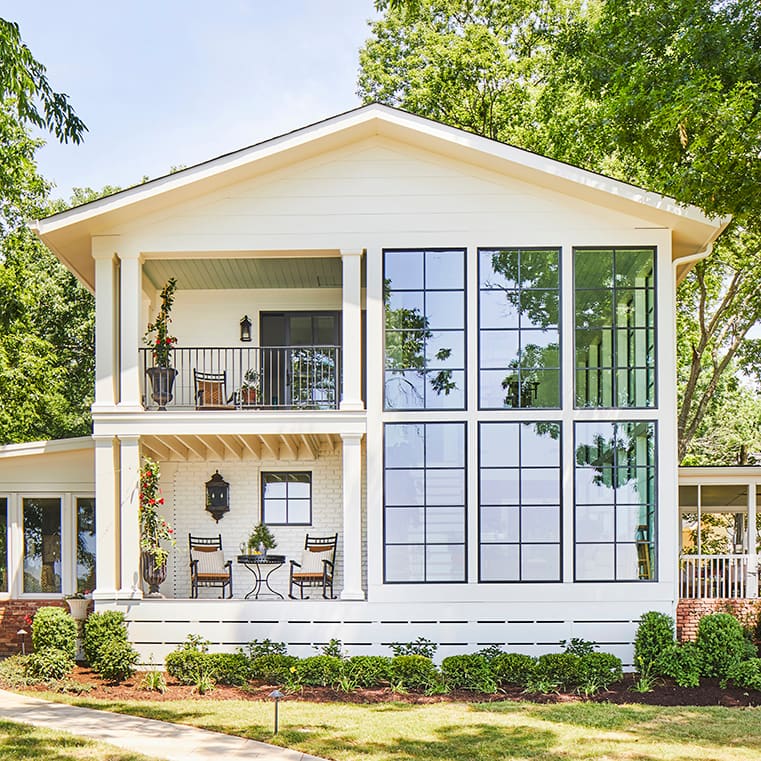 After image of remodeled lakehouse with new black windows