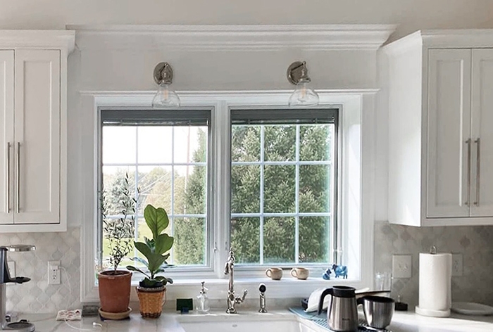 Interior view of Etters kitchen with newly installed casement windows allowing ventilation and natural light to illuminate the room.