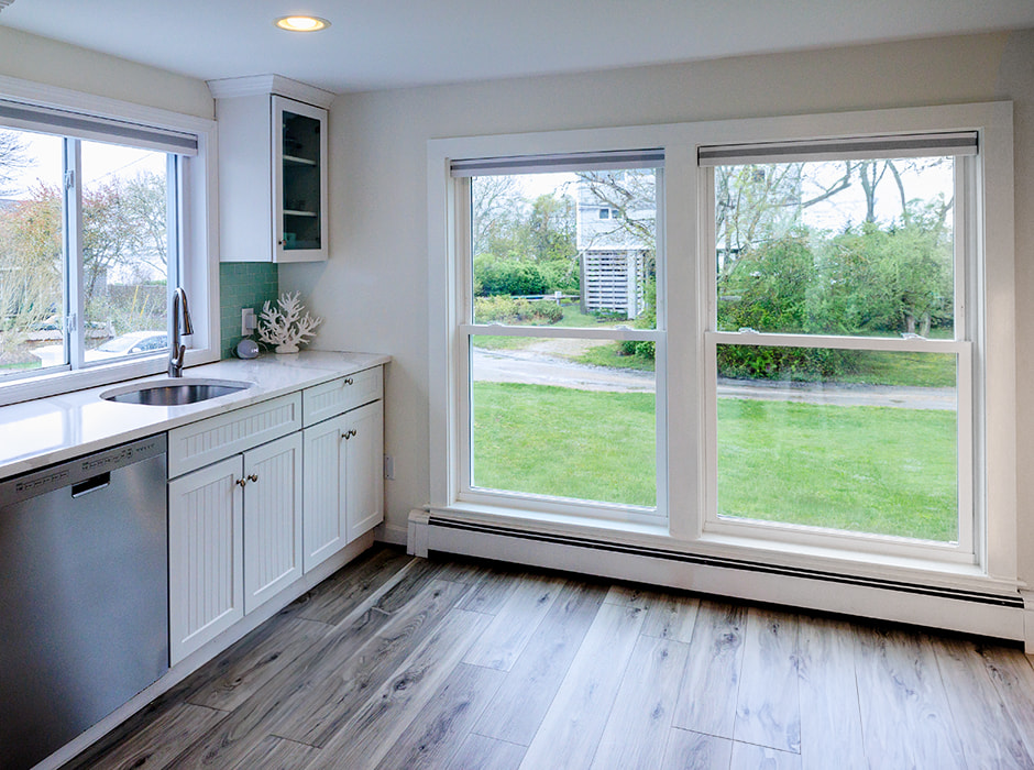 Large double-hung vinyl windows brightening South Kingston kitchen.