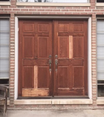 before - faded and sun damaged wood door sun damaged and faded wooden door with missing wood panels