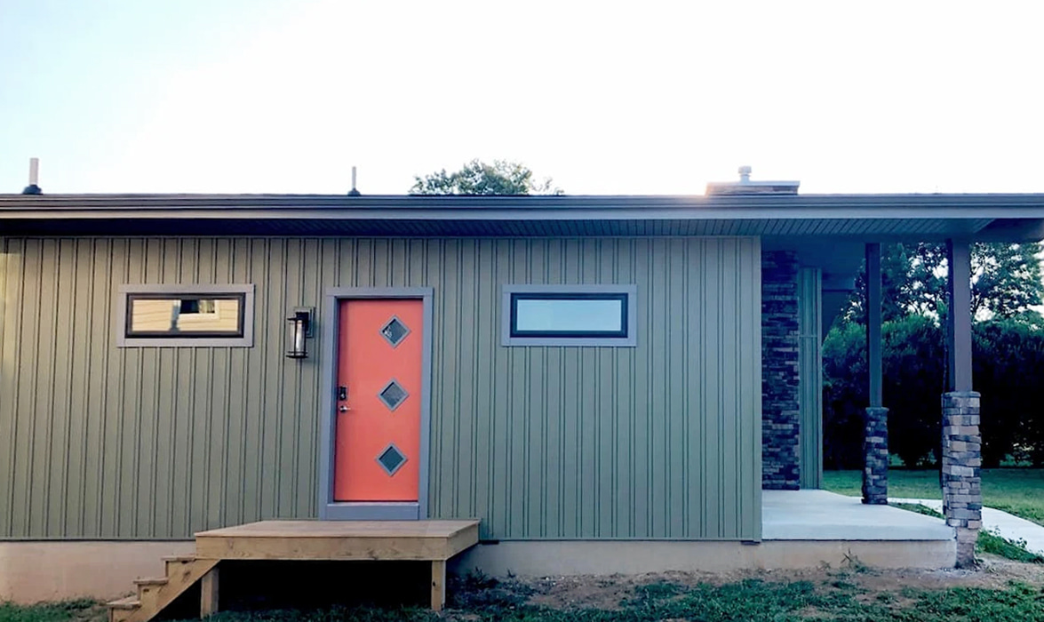 Sideview of a Modern Dillsburg home with newly installed black windows creating a striking exterior aesthetic.