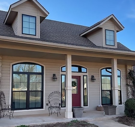 Edmunds, Oklahoma home exterior with new black vinyl windows