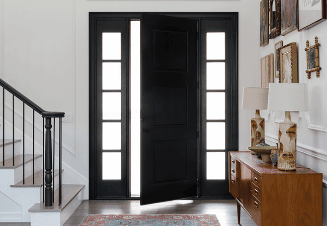 interior view of a black entry door with black trimmed sidelights on each side