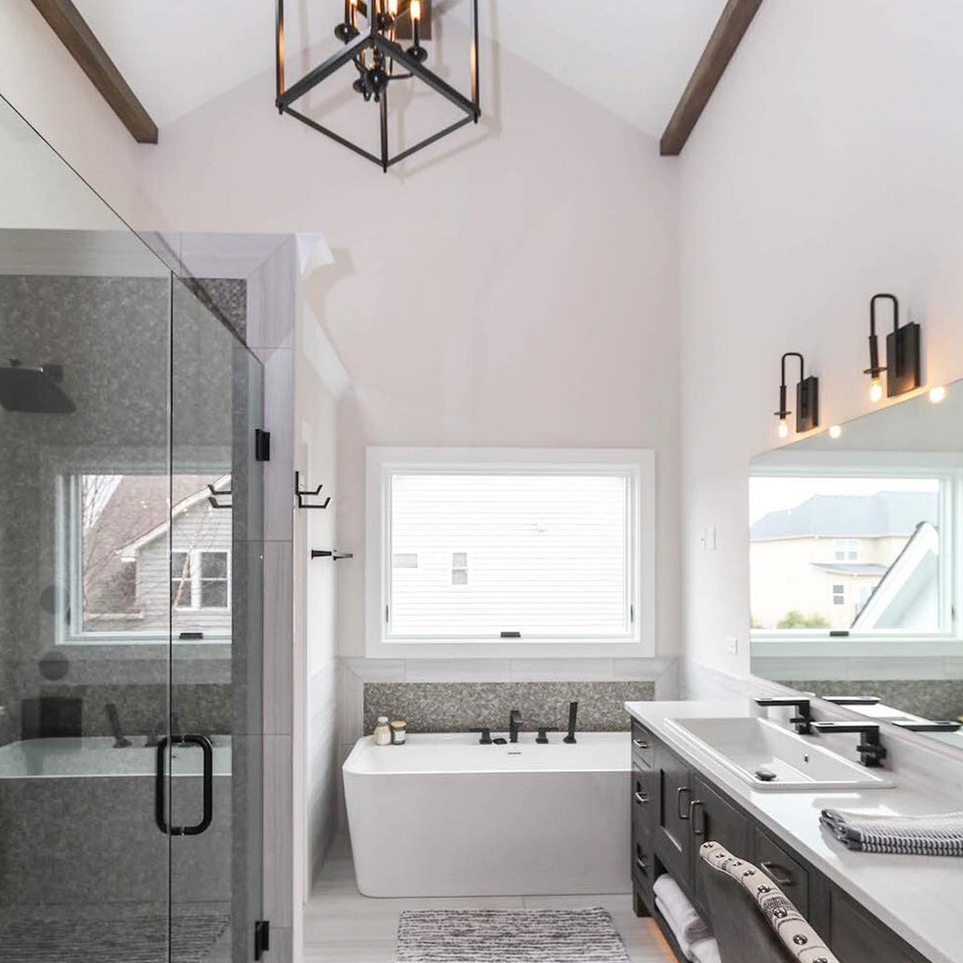 small bathroom window over a modern tub