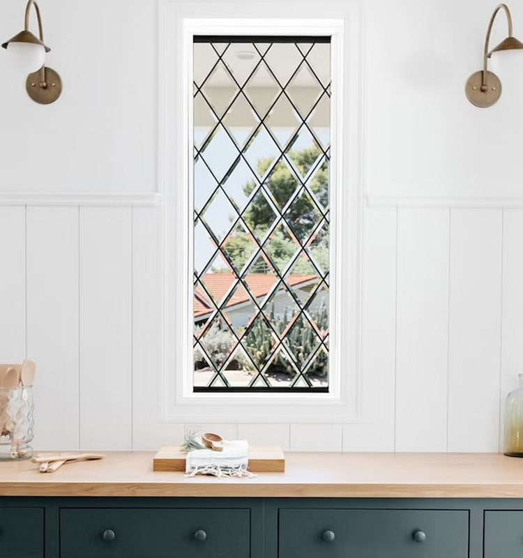 diamond-paned window over a wood counter