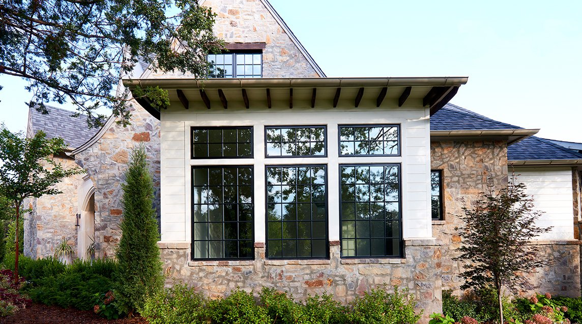 exterior brick home three black casement lifestyle series windows traditional grilles