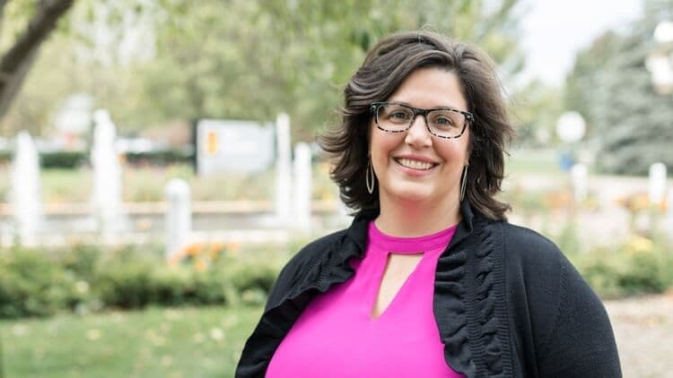 tricia van zee standing outside pella corporation