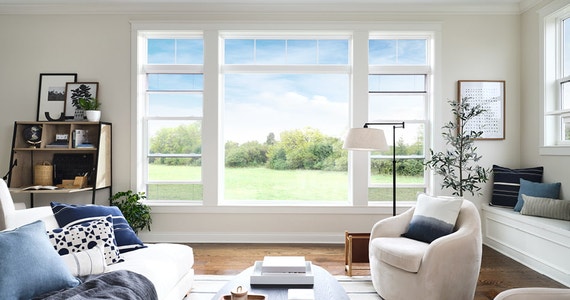 traditional living room three windows with hidden screens on the left and right windows