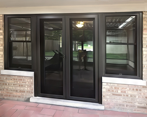 French doors flanked by new double-hung windows add a dramatic touch.