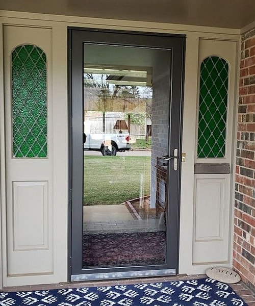 a full light storm door on an Oklahoma home exterior porch