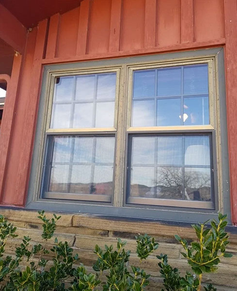 Outside view of an old window frame on a Davis home. 