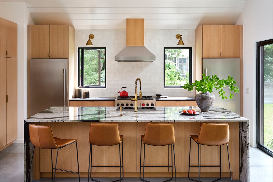 Neutral-colored mid-century modern kitchen, featuring over the sink windows.
