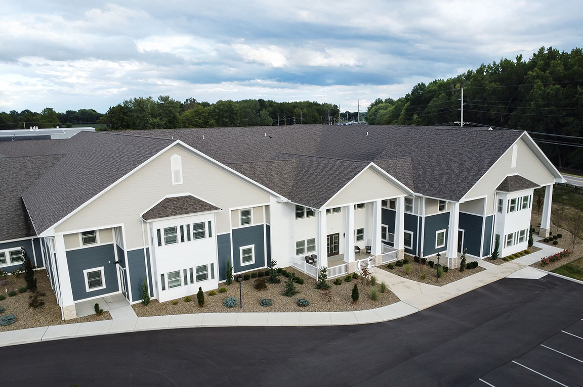 Wide exterior view of a multi-unit commercial building with modern windows.