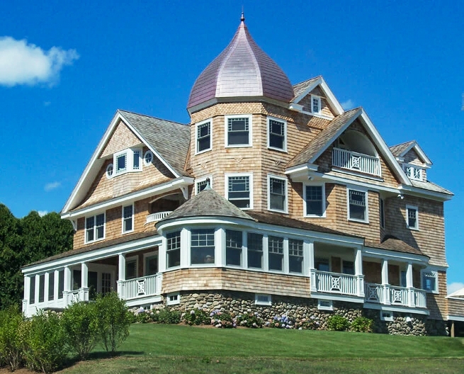 Exterior view of a South County Victorian home with newly replaced traditional Pella double-hung windows. 