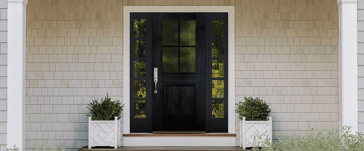 wood entry door with 2x4 grilles and 1/4 light sidelights