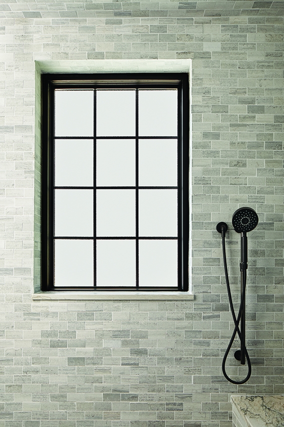 Black framed window in bathroom