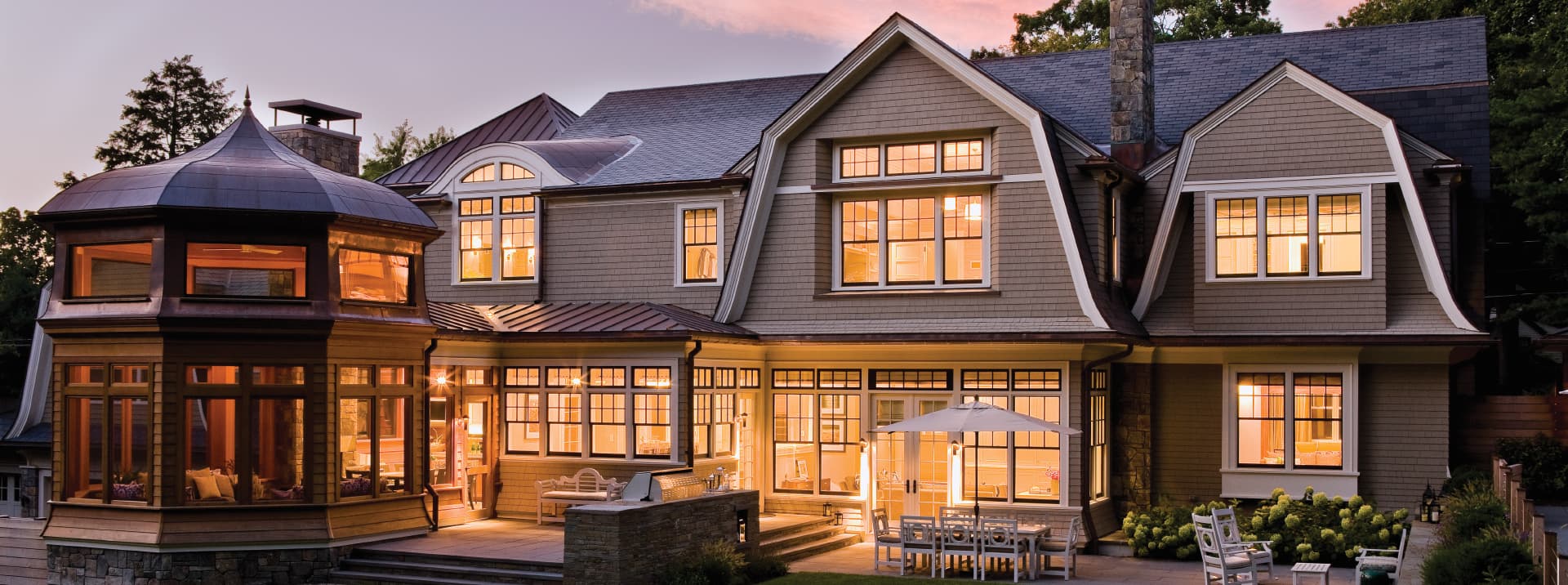 exterior home at dusk with pella reserve products