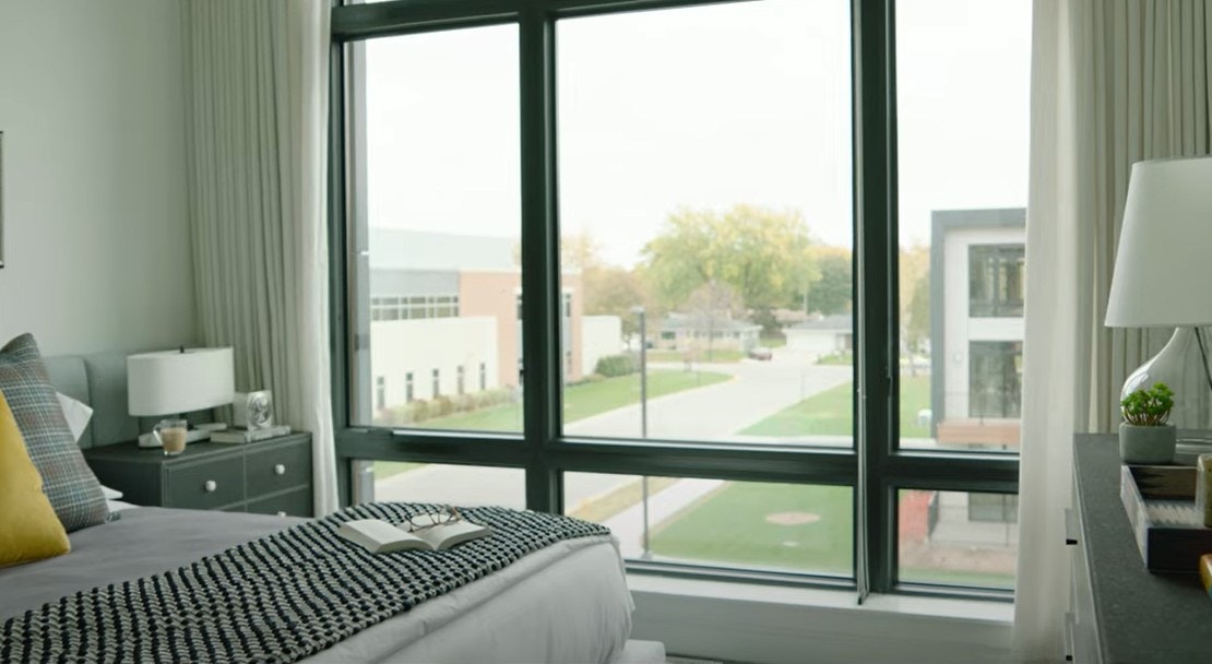 expansive pella impervia fixed windows look out over Title Town in Wisconsin