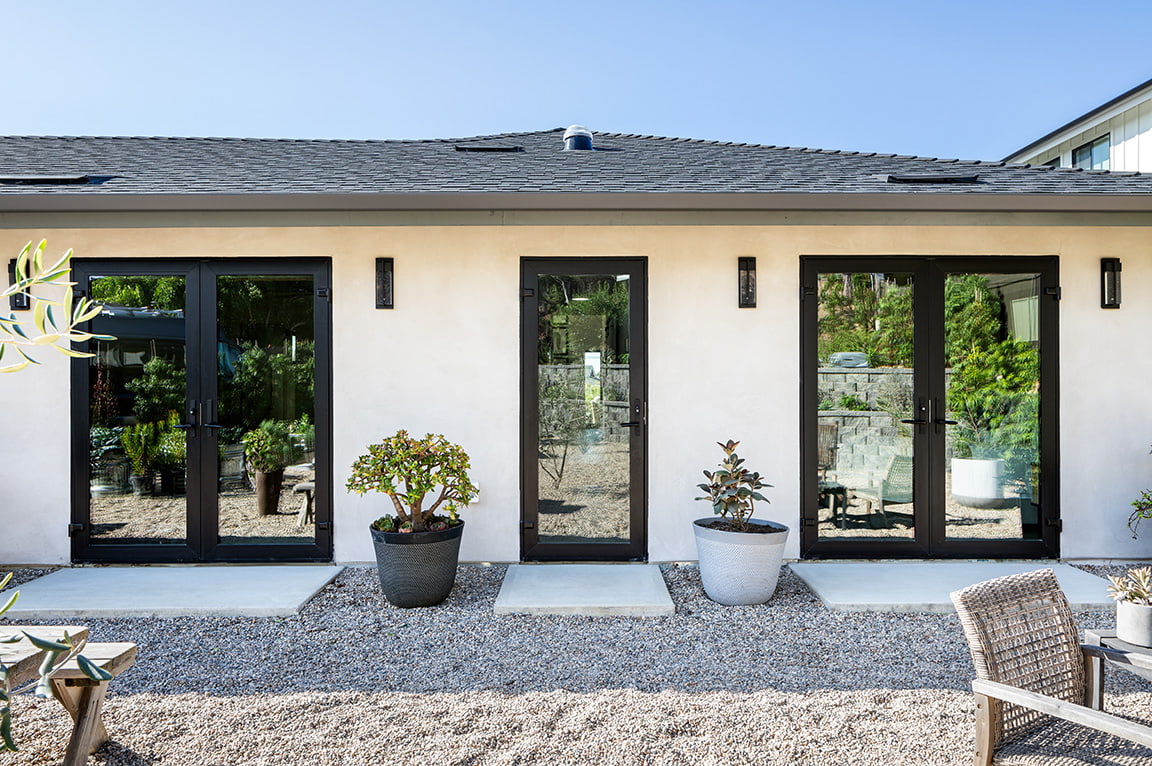 black-frame-patio-doors-white-stucco-exterior.jpg