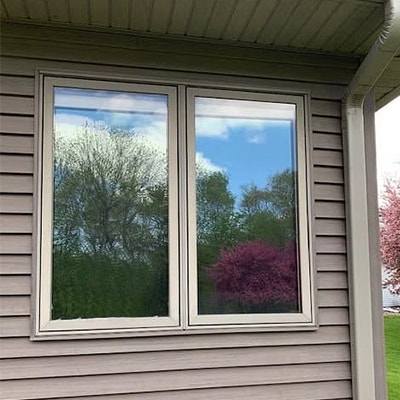 A large double-hung window has been replaced with two Pella Impervia fiberglass casement windows.