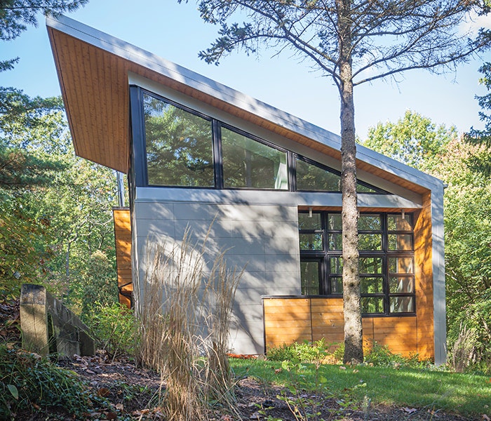 Angled Clerestory windows on a home with a single steeply angled roof