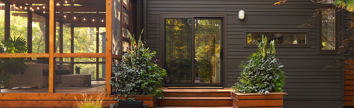 home office with green walls and pella impervia sliding patio door