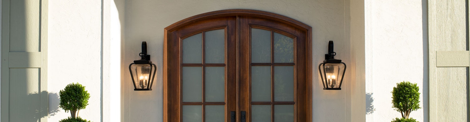 home exterior with an arched two-panel entry door