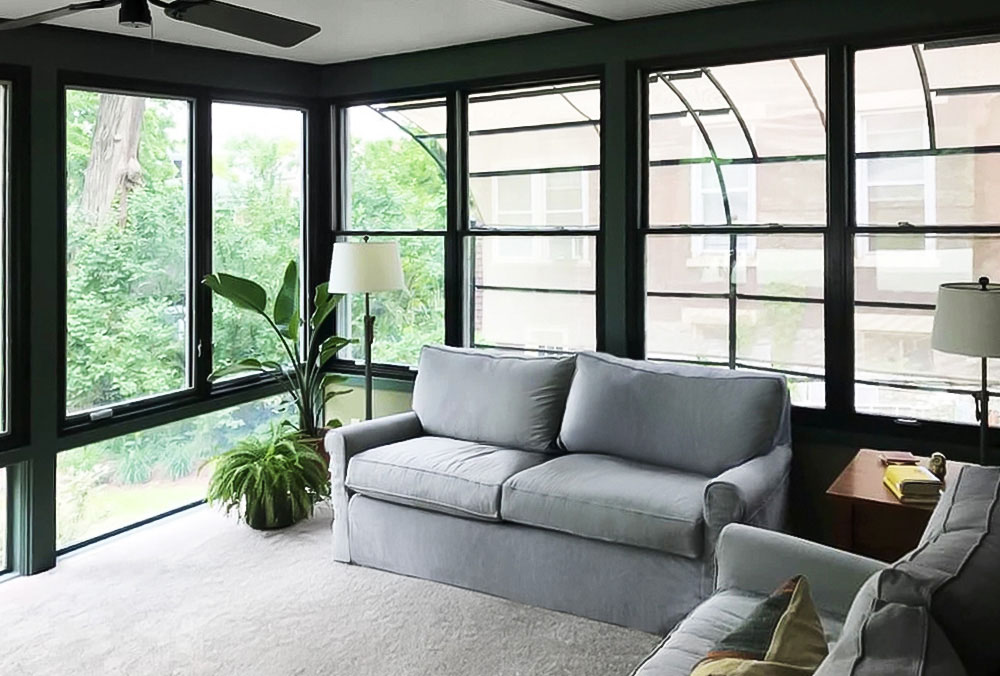 Cincinnati solarium with newly installed windows blending indoor and outdoor living.