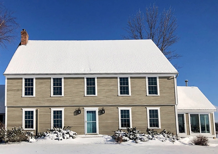 Exterior view of Vermont historical home with newly installed Pella windows.