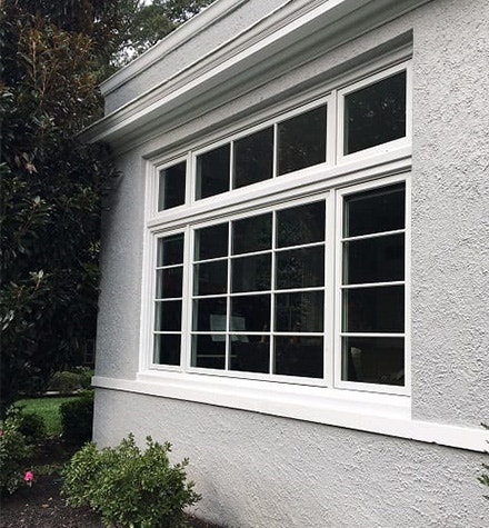 brand new wood windows and transom on a gray colonial home