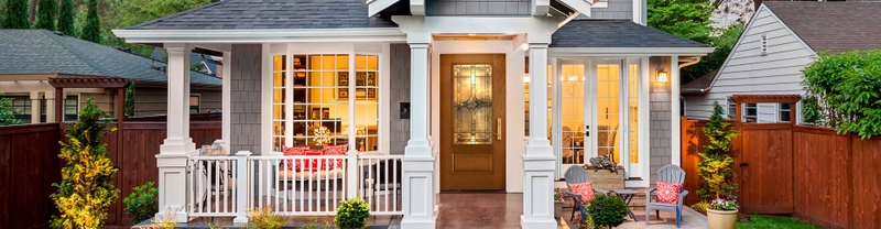 exterior home at dusk with 3/4 light entry door in provincial stain with huxley