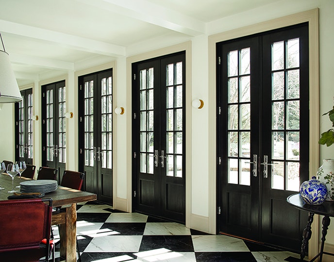 Dining room in Idaho with newly installed black french doors.