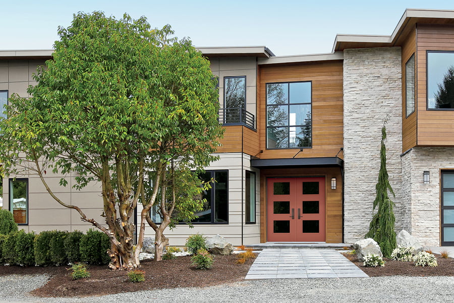 Modern home with fiberglass double entry doors and two stories