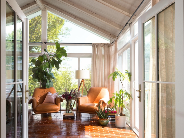 Minnesota cottage home sunroom with newly installed Pella patio door and windows.