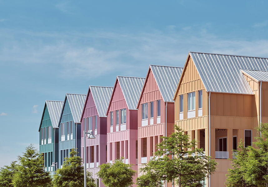a row of five houses in pastel colors in the Wheeler District of Oklahoma