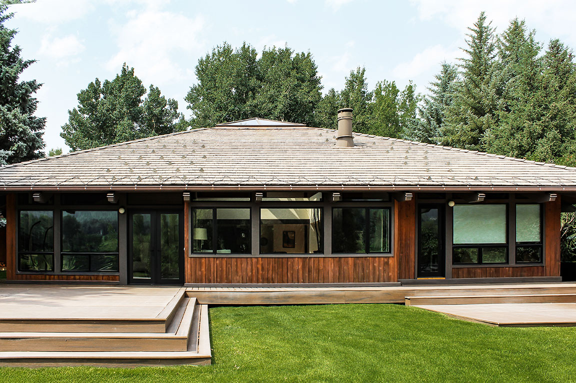 Aspen Energy Efficient home with wood siding and large windows.