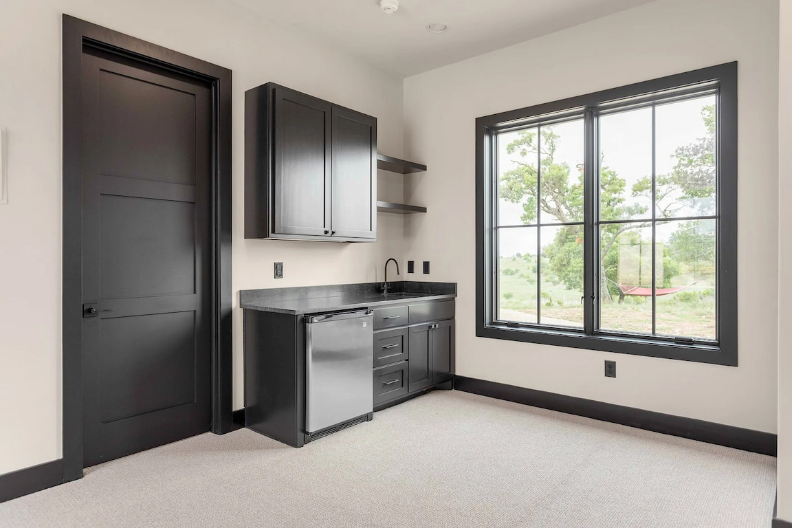Bathroom of Texas Hill Country  home with newly installed black windows.