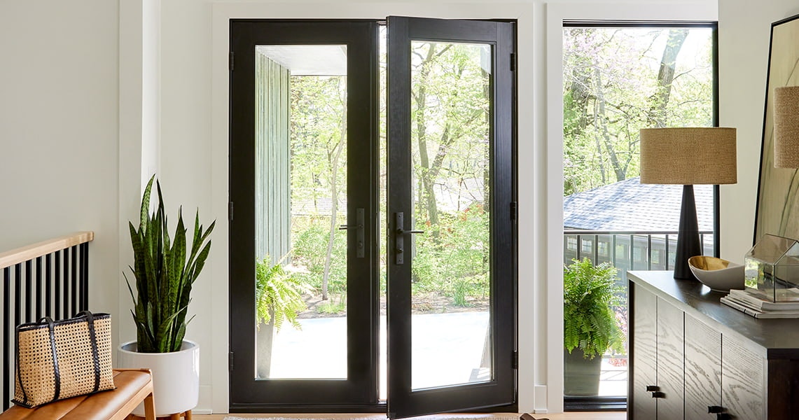 two Pella Reserve hinged doors with a beautiful black stain to complement the home's style