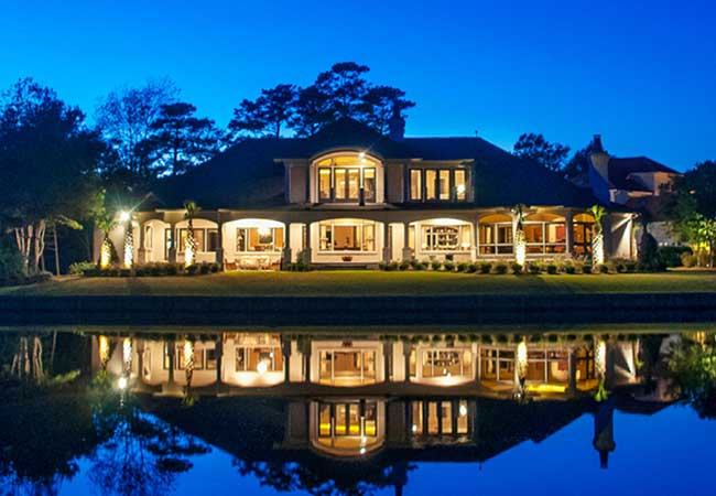 Lakeside cream-colored home.