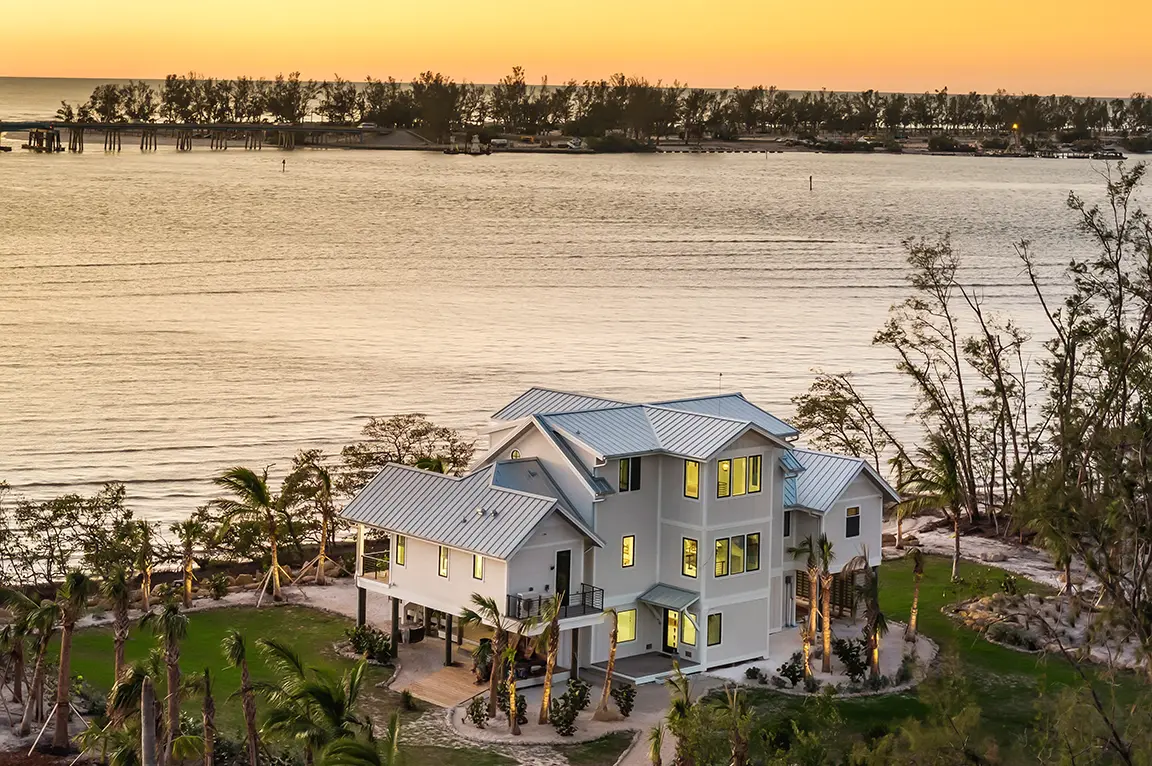 modern-waterfront-beach-house-sunset.webp