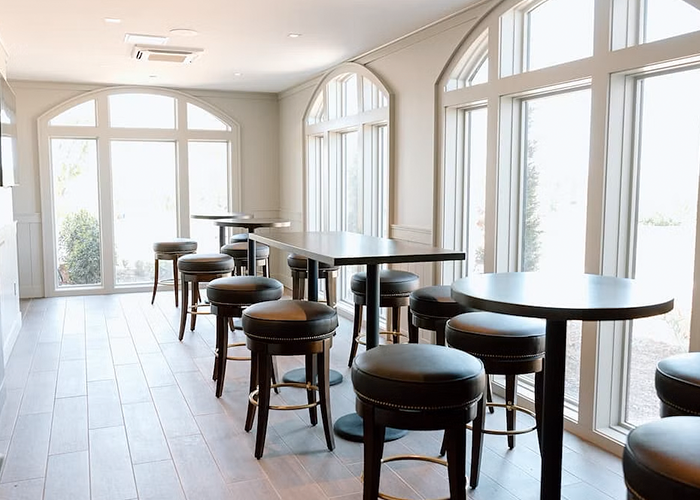 tall arched windows open up space in country club