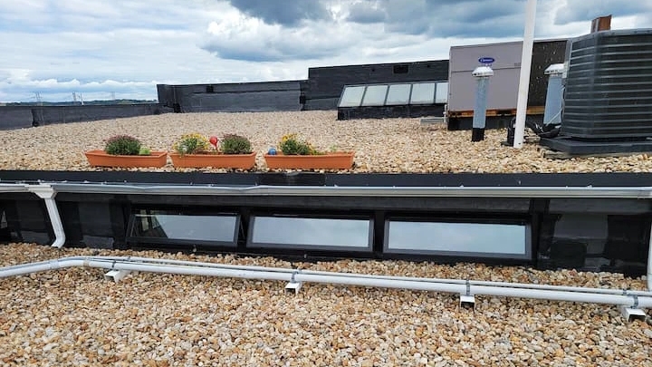 Pella fiberglass awning windows on Virginia condo rooftop.